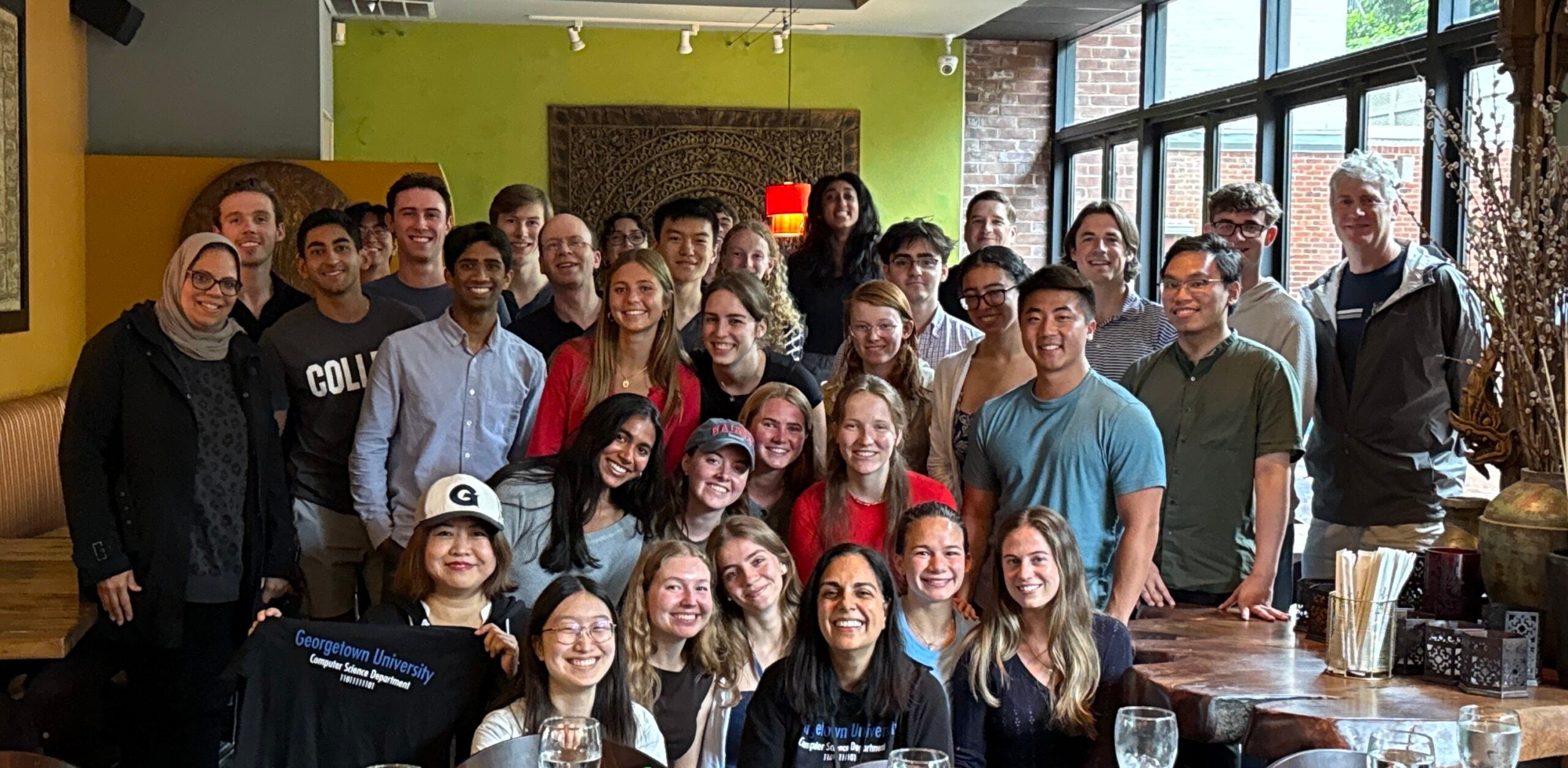 Group of student and faculty pose 