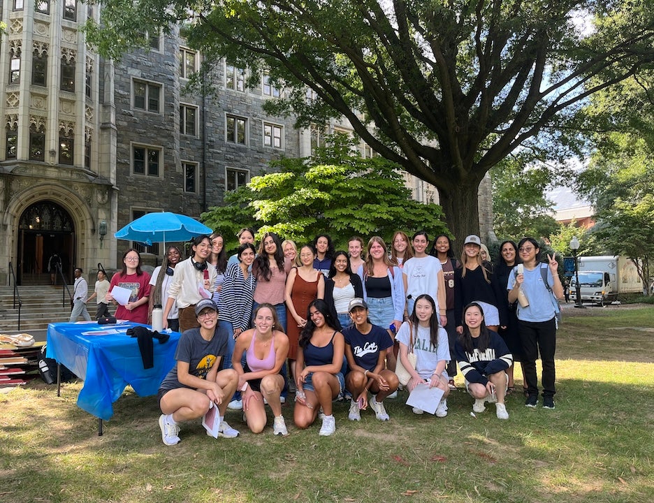 A group of women post for a picture on Healy Lawn