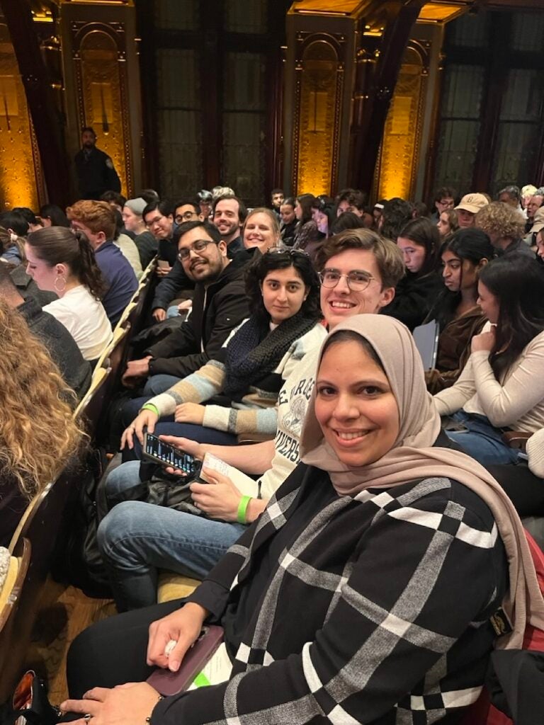 Faculty and students sitting in auditorium