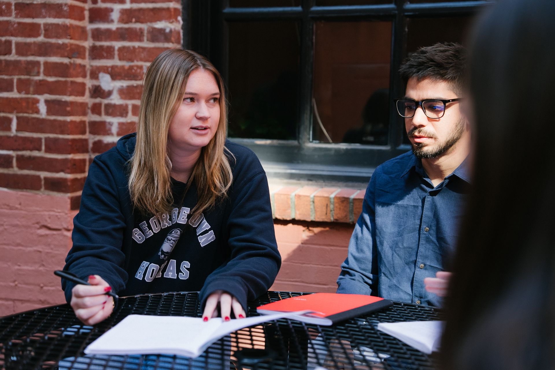 Two students studying outside