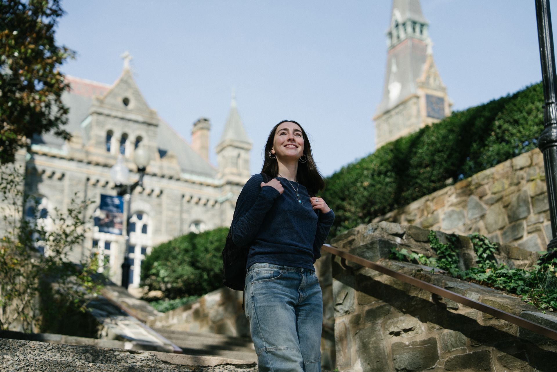 A student walking down some outdoor steps on Main Campus
